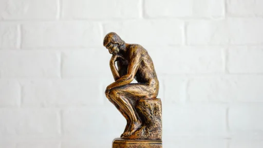 brown concrete statue of man